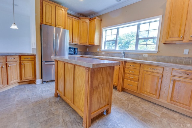 1121 Red Hill Rd, Big Island, VA 24526 - kitchen featuring freestanding refrigerator, ornamental molding, light countertops, a kitchen island, and pendant lighting