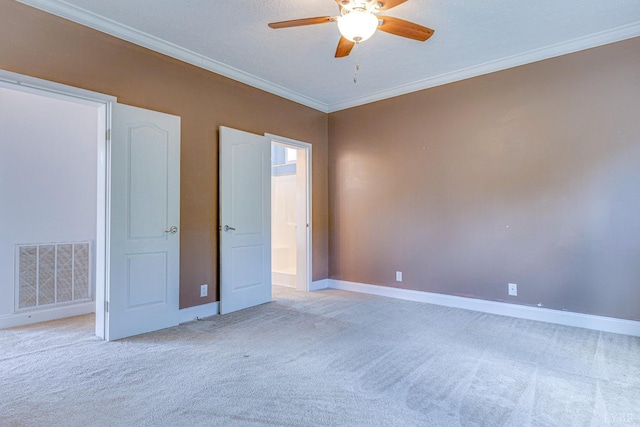 1121 Red Hill Rd, Big Island, VA 24526 - unfurnished bedroom with light colored carpet, crown molding, ensuite bathroom, and a ceiling fan