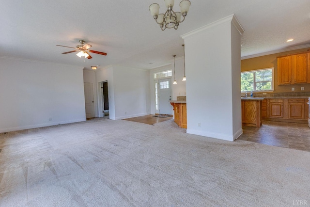 1121 Red Hill Rd, Big Island, VA 24526 - unfurnished living room with plenty of natural light, light carpet, ornamental molding, a ceiling fan, and a chandelier