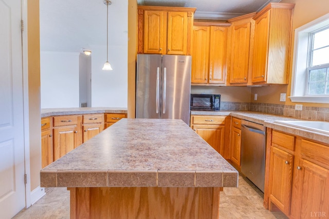 1121 Red Hill Rd, Big Island, VA 24526 - kitchen featuring appliances with stainless steel finishes, a kitchen island, light countertops, and pendant lighting