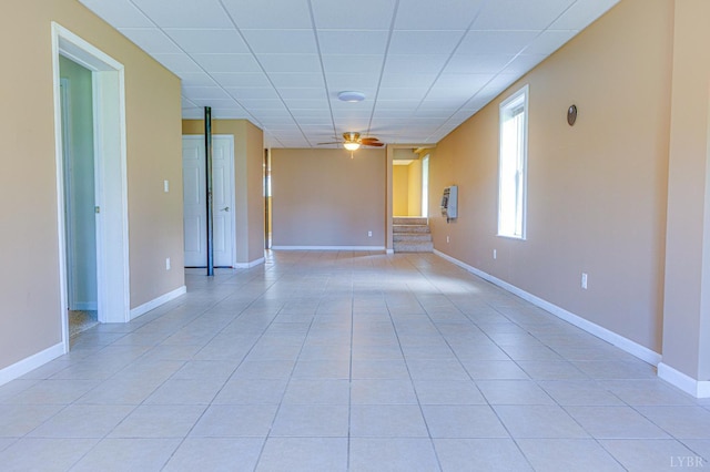 1121 Red Hill Rd, Big Island, VA 24526 - spare room featuring a paneled ceiling, a ceiling fan, light tile patterned floors, and stairway