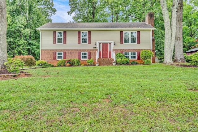 51 Laurel Ln, Lynchburg, VA 24502 - bi-level home featuring a chimney, brick siding, and a front lawn