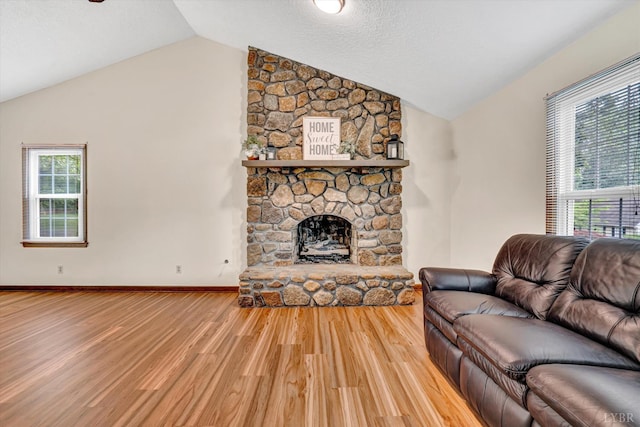 51 Laurel Ln, Lynchburg, VA 24502 - living area featuring vaulted ceiling, wood finished floors, and a fireplace