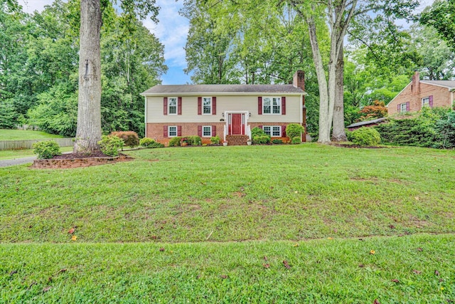 51 Laurel Ln, Lynchburg, VA 24502 - split foyer home featuring a chimney, brick siding, and a front lawn