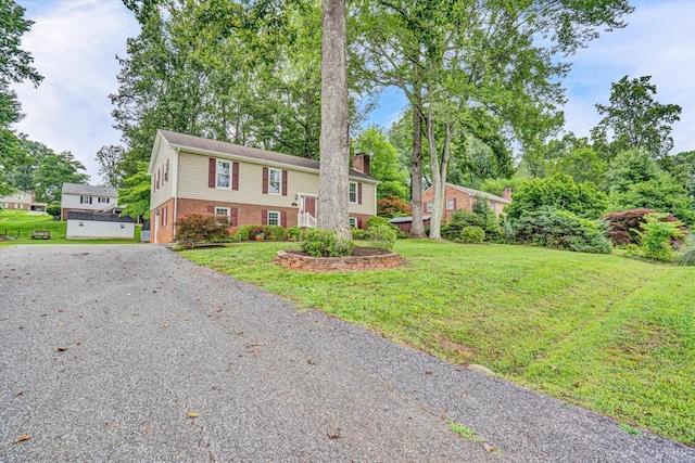 51 Laurel Ln, Lynchburg, VA 24502 - split foyer home with a chimney, brick siding, a front lawn, and driveway