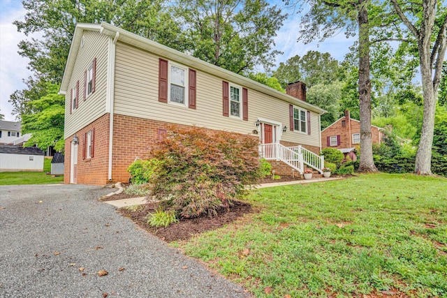 51 Laurel Ln, Lynchburg, VA 24502 - raised ranch with a chimney, brick siding, a front lawn, and driveway