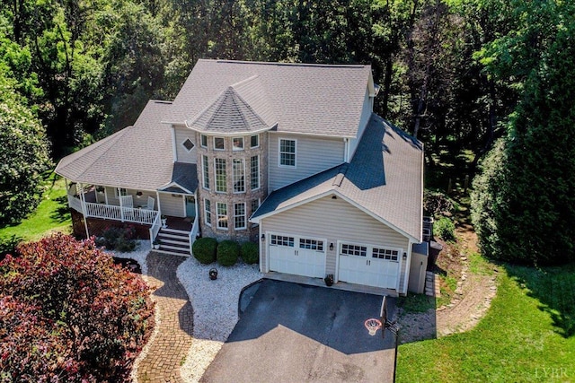 802 Lake Vista Dr, Forest, VA 24551 - view of front of home with covered porch, asphalt driveway, roof with shingles, and a garage