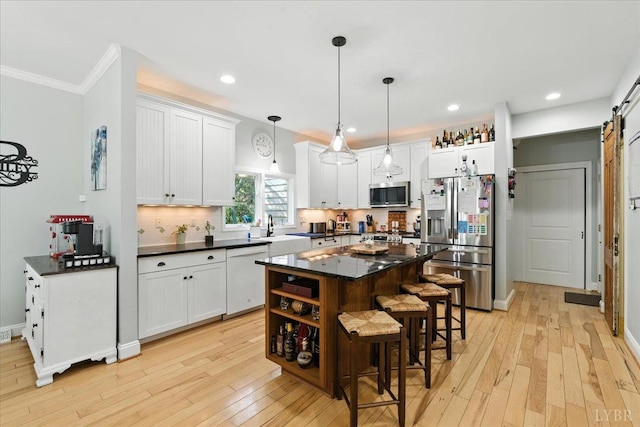 802 Lake Vista Dr, Forest, VA 24551 - kitchen featuring appliances with stainless steel finishes, ornamental molding, a kitchen bar, decorative backsplash, and white cabinetry