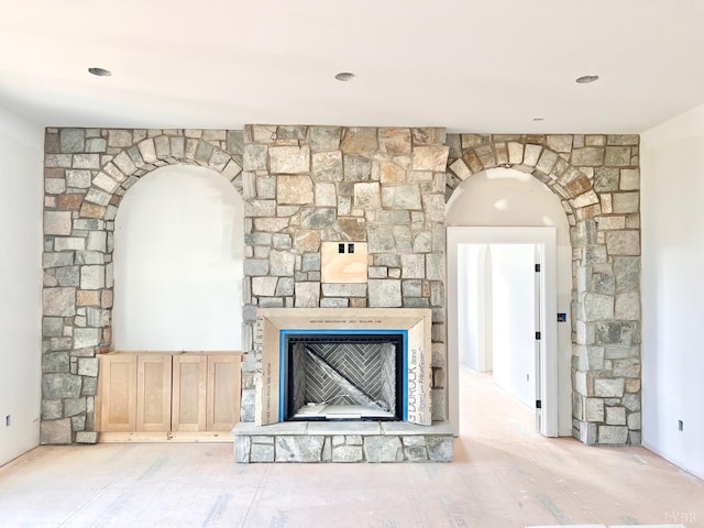 1608 Autumn Run Dr, Forest, VA 24551 - unfurnished living room with arched walkways and a stone fireplace