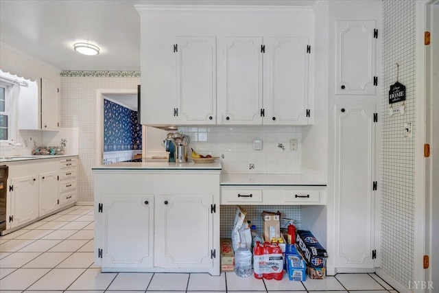 6032 Rhonda Rd, Lynchburg, VA 24502 - kitchen with white cabinetry, backsplash, crown molding, light countertops, and light tile patterned flooring