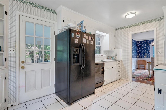 6032 Rhonda Rd, Lynchburg, VA 24502 - kitchen with black appliances, wallpapered walls, white cabinetry, crown molding, and plenty of natural light