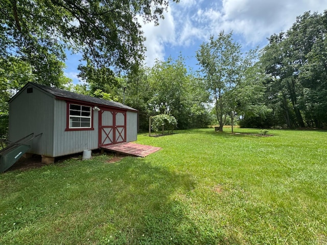 166 Dutch Ln, Appomattox, VA 24522 - view of green lawn featuring a storage shed and view of scattered trees