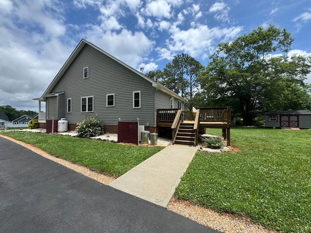 166 Dutch Ln, Appomattox, VA 24522 - view of property exterior featuring a shed, a wooden deck, and a lawn