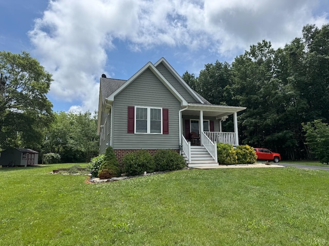 166 Dutch Ln, Appomattox, VA 24522 - view of front of property with covered porch, a front lawn, and a storage unit