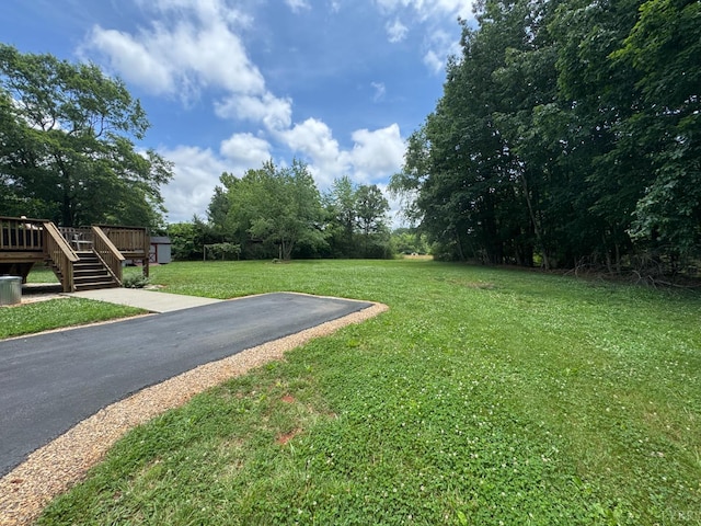 166 Dutch Ln, Appomattox, VA 24522 - view of grassy yard featuring a deck and stairs