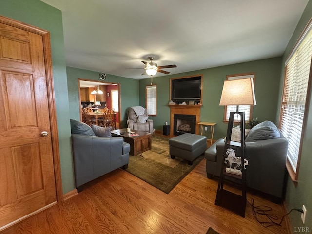 166 Dutch Ln, Appomattox, VA 24522 - living area with a fireplace, wood finished floors, and ceiling fan