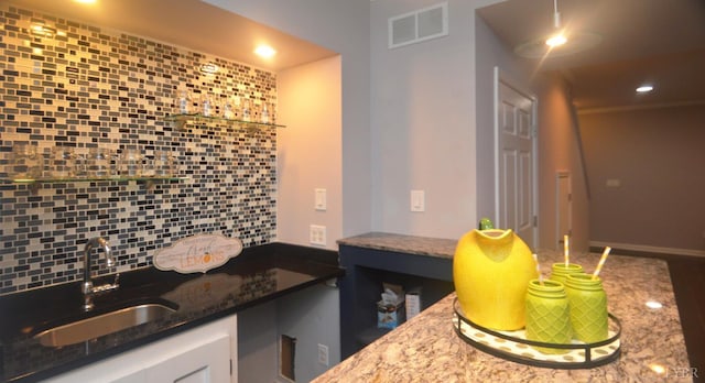 3600 Old Forest Rd Unit 113, Lynchburg, VA 24502 - kitchen featuring tasteful backsplash, stone countertops, white cabinetry, and recessed lighting
