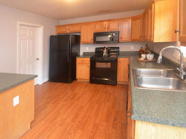3600 Old Forest Rd Unit 113, Lynchburg, VA 24502 - kitchen featuring black appliances, dark countertops, and light wood finished floors