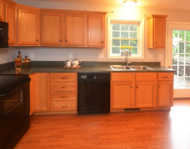 3600 Old Forest Rd Unit 113, Lynchburg, VA 24502 - kitchen featuring black appliances, dark countertops, and light wood-style flooring