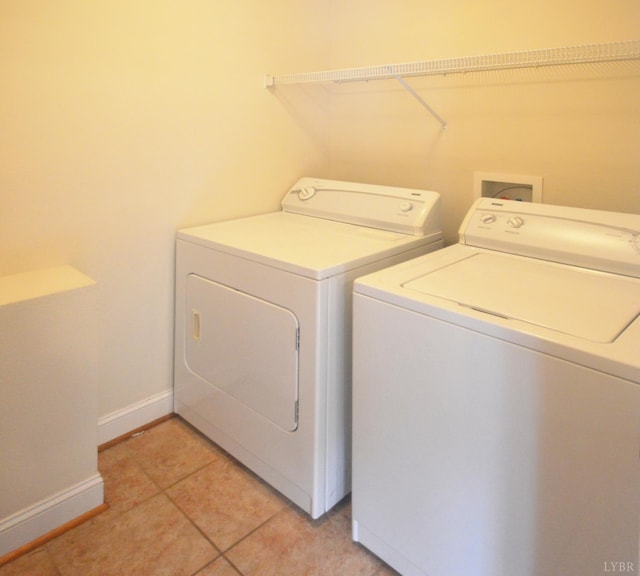 3600 Old Forest Rd Unit 113, Lynchburg, VA 24502 - washroom featuring washer and clothes dryer and light tile patterned floors
