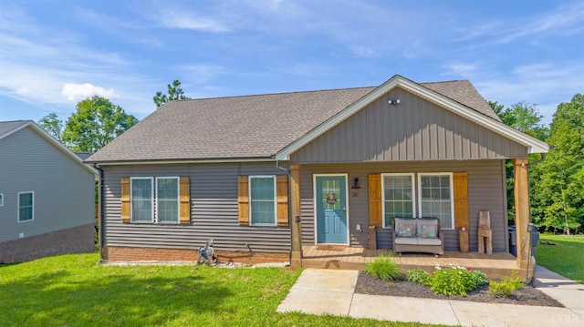 30 Patrick Ct, Madison Heights, VA 24572 - bungalow-style house with a front lawn, a porch, roof with shingles, and an outdoor hangout area