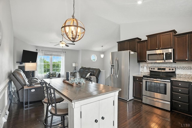 4086 Thomas Jefferson Rd, Forest, VA 24551 - kitchen featuring open floor plan, appliances with stainless steel finishes, dark wood-style flooring, a chandelier, and dark brown cabinetry