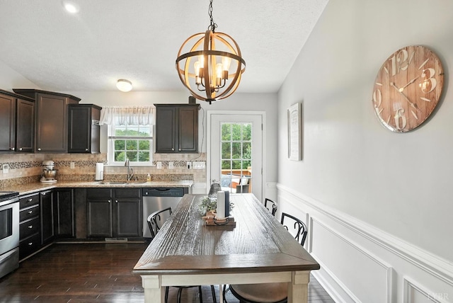 4086 Thomas Jefferson Rd, Forest, VA 24551 - kitchen featuring appliances with stainless steel finishes, a chandelier, dark wood finished floors, decorative backsplash, and decorative light fixtures