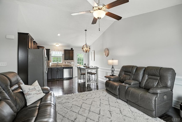 4086 Thomas Jefferson Rd, Forest, VA 24551 - living room featuring dark wood-style floors, a ceiling fan, wainscoting, and lofted ceiling