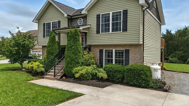 4086 Thomas Jefferson Rd, Forest, VA 24551 - view of front of property with a front yard and brick siding