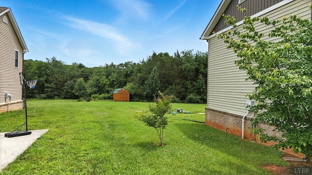 4086 Thomas Jefferson Rd, Forest, VA 24551 - view of grassy yard with a storage unit and a view of trees