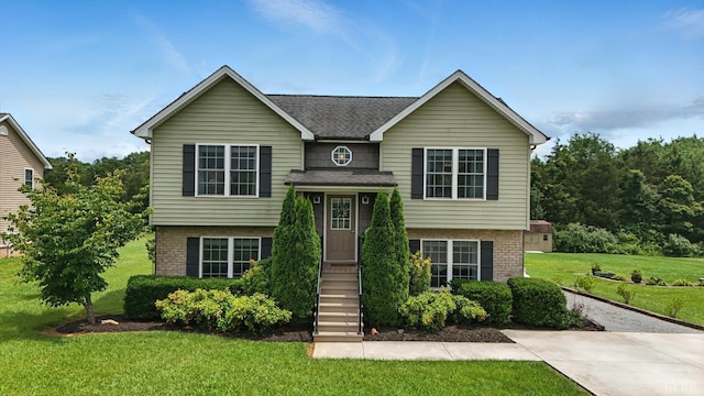 4086 Thomas Jefferson Rd, Forest, VA 24551 - bi-level home with a front lawn, brick siding, and a shingled roof