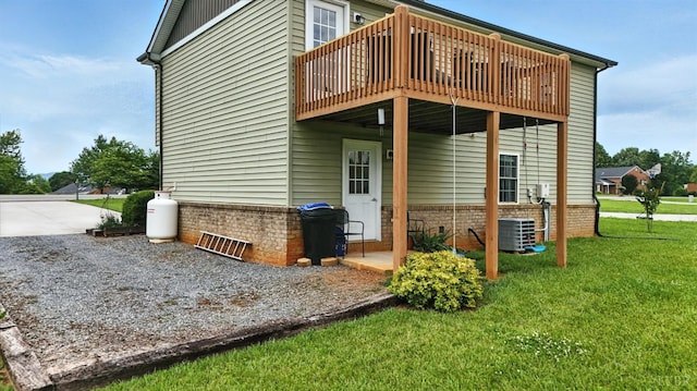 4086 Thomas Jefferson Rd, Forest, VA 24551 - rear view of house featuring a yard, a wooden deck, driveway, and brick siding