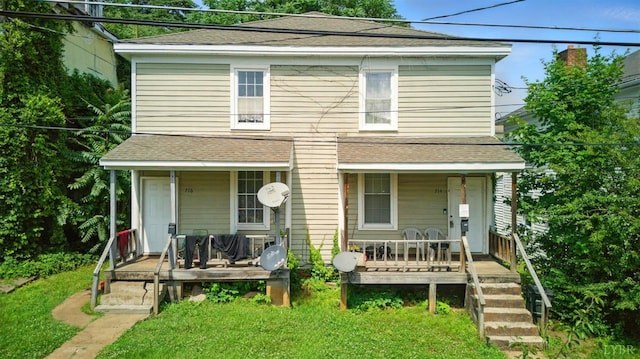 714 Madison St, Lynchburg, VA 24504 - rear view of house with a porch, roof with shingles, and a yard