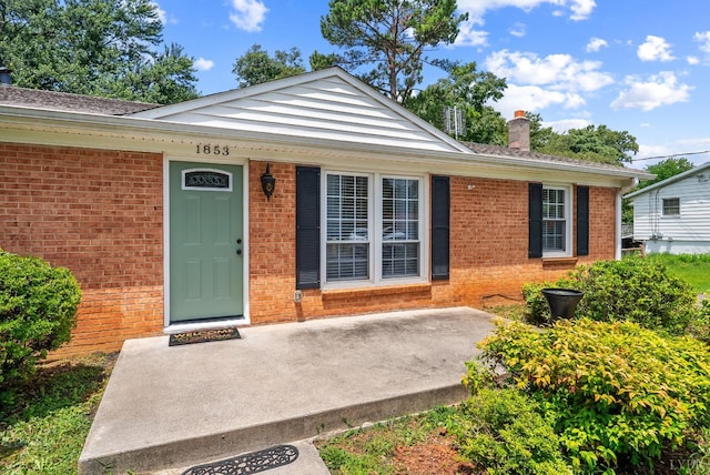 1853 Rainbow Forest Dr, Lynchburg, VA 24502 - doorway to property with brick siding and a chimney