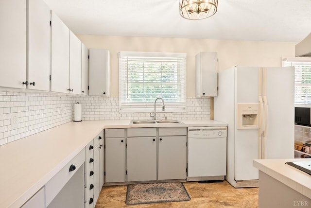 1853 Rainbow Forest Dr, Lynchburg, VA 24502 - kitchen with white appliances, healthy amount of natural light, decorative backsplash, and light countertops