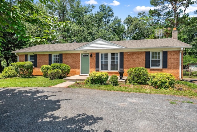 1853 Rainbow Forest Dr, Lynchburg, VA 24502 - ranch-style house featuring brick siding, a chimney, and roof with shingles