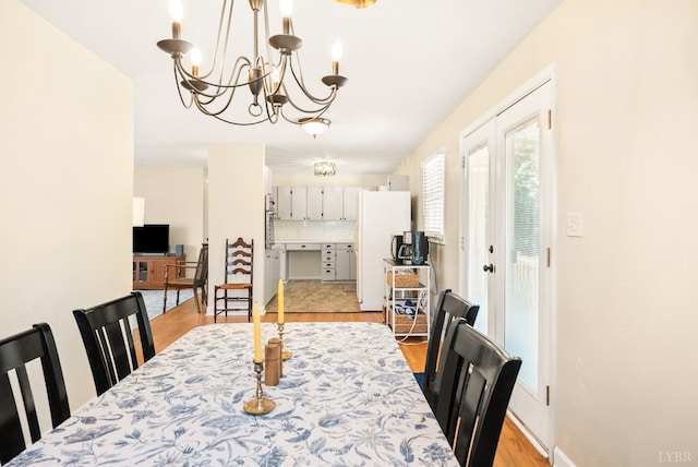 1853 Rainbow Forest Dr, Lynchburg, VA 24502 - dining space with a chandelier and light wood-style flooring
