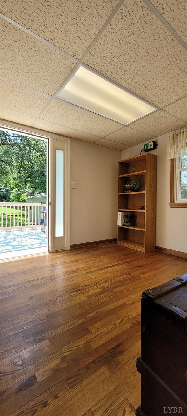 1769 Izaak Walton Rd, Madison Heights, VA 24572 - unfurnished living room featuring a paneled ceiling and wood finished floors