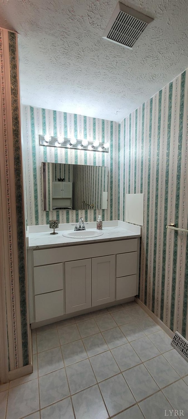 1769 Izaak Walton Rd, Madison Heights, VA 24572 - bathroom featuring wallpapered walls, vanity, tile patterned floors, and a textured ceiling