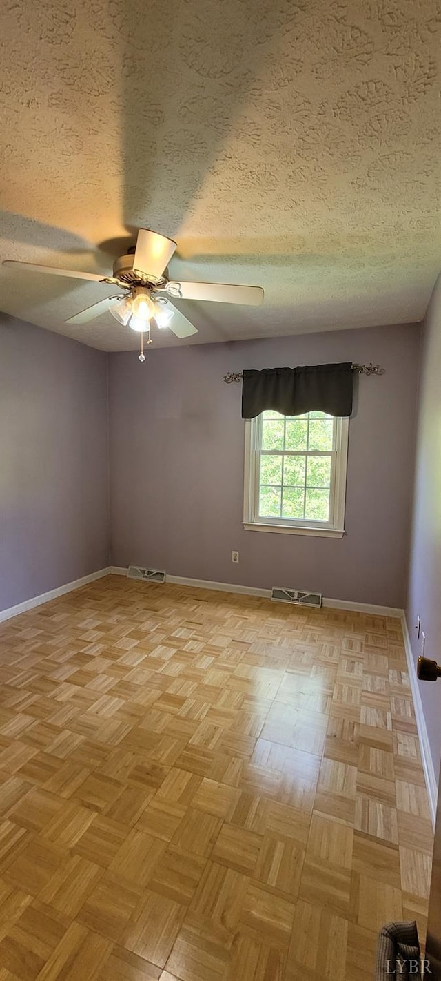 1769 Izaak Walton Rd, Madison Heights, VA 24572 - spare room with a textured ceiling and ceiling fan