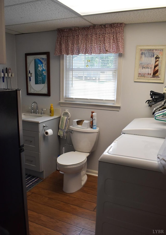 1769 Izaak Walton Rd, Madison Heights, VA 24572 - bathroom with washing machine and clothes dryer, vanity, wood finished floors, and a paneled ceiling