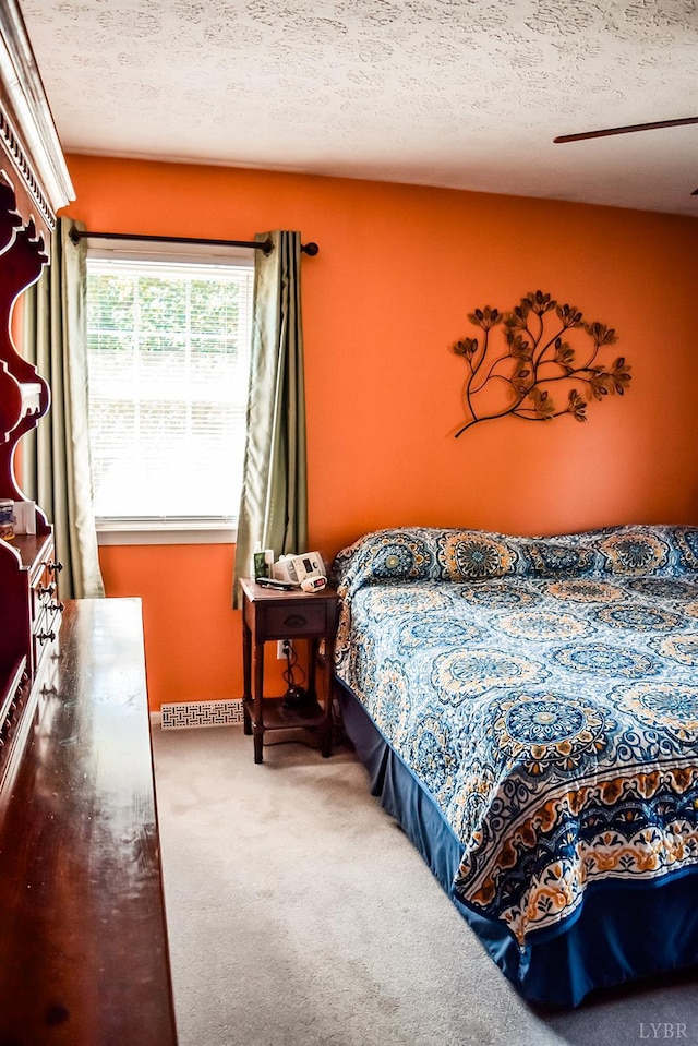 1769 Izaak Walton Rd, Madison Heights, VA 24572 - bedroom with carpet, a textured ceiling, and a ceiling fan