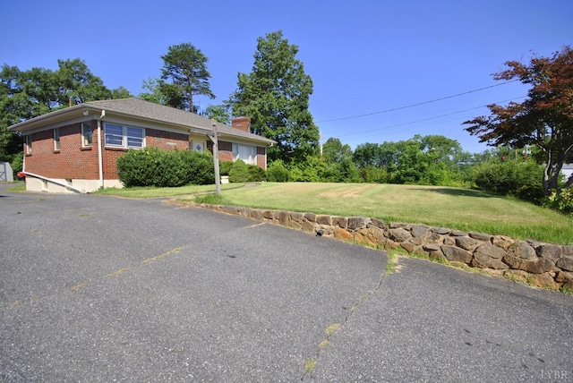 6120 Edgewood Ave, Lynchburg, VA 24502 - view of front of property featuring brick siding, a front yard, and a chimney
