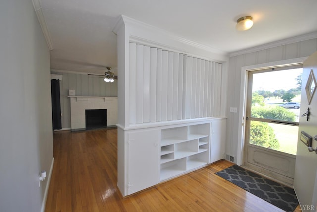 6120 Edgewood Ave, Lynchburg, VA 24502 - entryway with crown molding, wood-type flooring, ceiling fan, and a fireplace