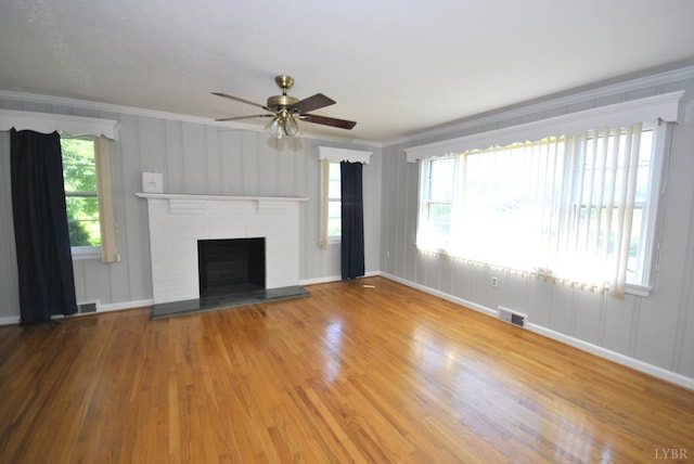 6120 Edgewood Ave, Lynchburg, VA 24502 - unfurnished living room featuring crown molding, wood finished floors, a ceiling fan, and a brick fireplace