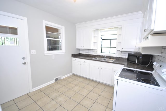 6120 Edgewood Ave, Lynchburg, VA 24502 - kitchen featuring white electric stove, black microwave, open shelves, decorative backsplash, and white cabinetry