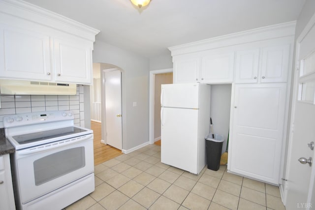 6120 Edgewood Ave, Lynchburg, VA 24502 - kitchen featuring white appliances, under cabinet range hood, arched walkways, and white cabinetry