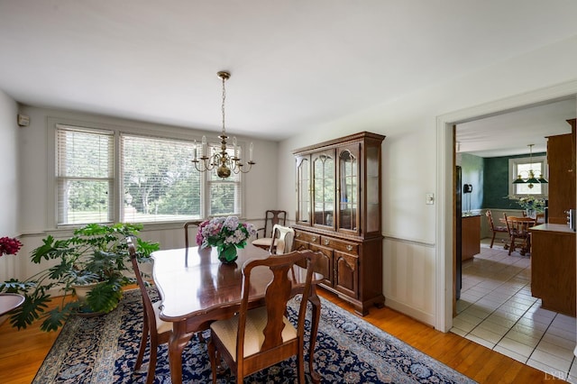 2833 Link Rd, Lynchburg, VA 24503 - dining area with a chandelier, plenty of natural light, light wood-type flooring, and a wainscoted wall