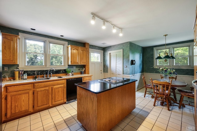 2833 Link Rd, Lynchburg, VA 24503 - kitchen with dishwasher, a kitchen island, a wainscoted wall, light tile patterned floors, and gas cooktop