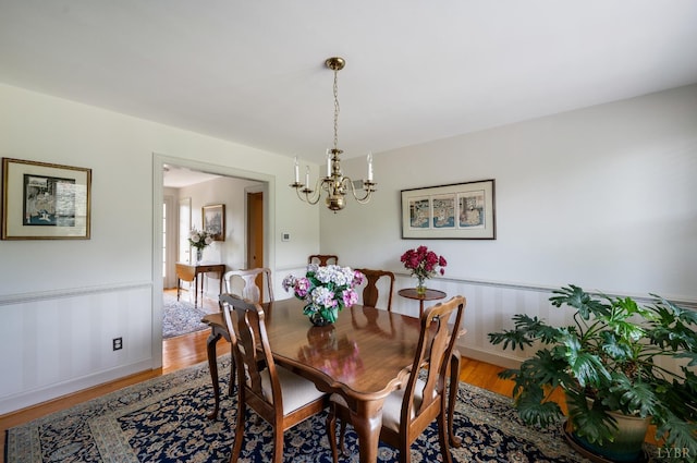2833 Link Rd, Lynchburg, VA 24503 - dining room featuring a chandelier, light wood-type flooring, and wainscoting
